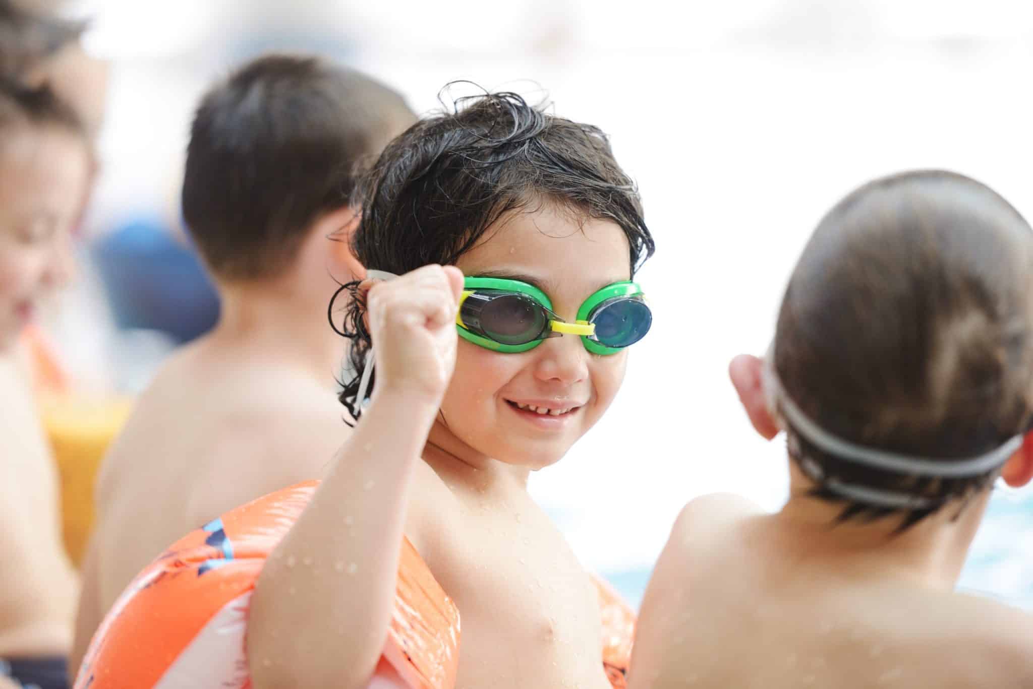 Children enjoying swimming pool fun at O'Neil Pools, LLC outdoor pool construction and maintenance.