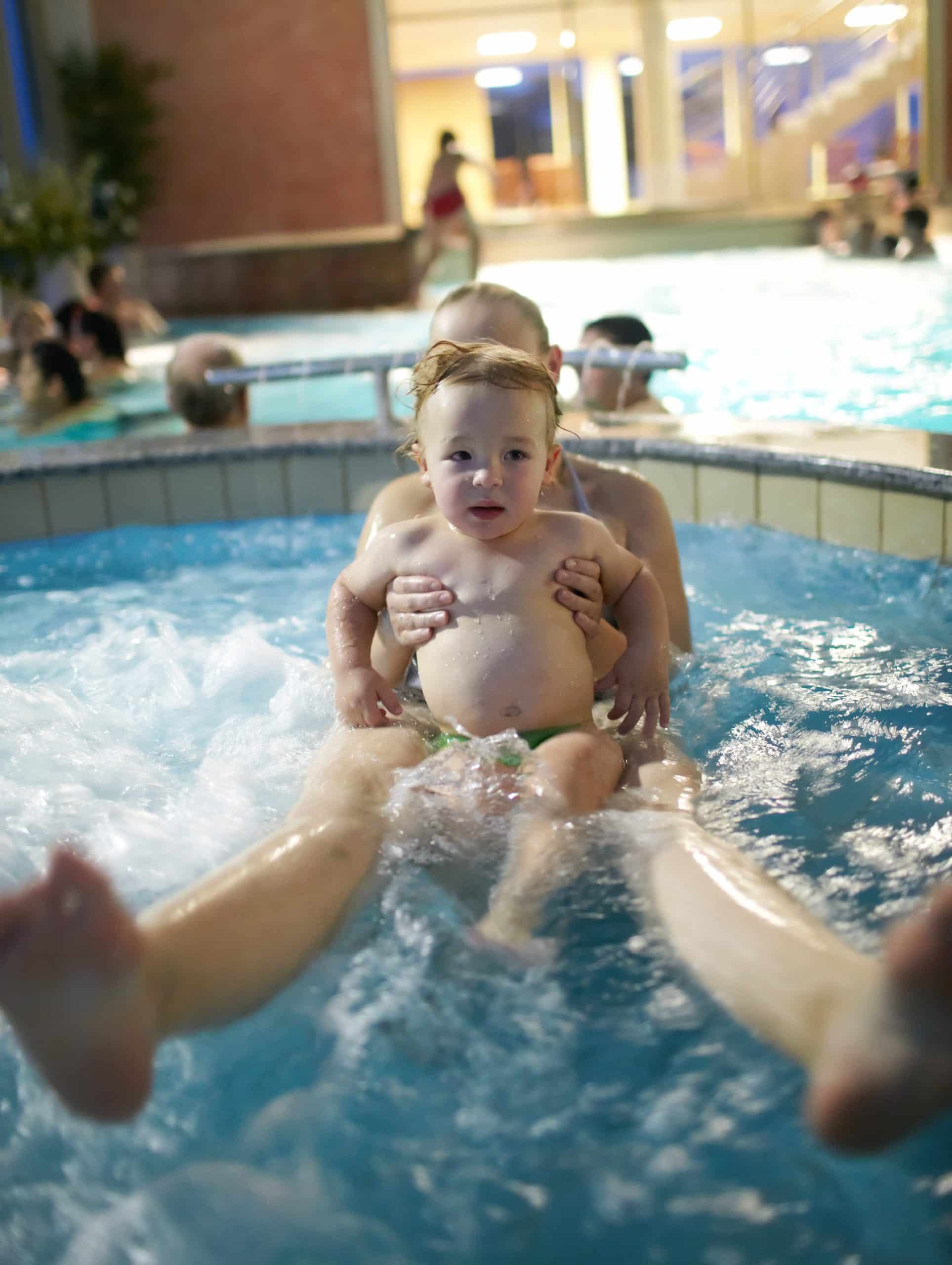 Sweet young child enjoying a pool at O'Neil Pools, LLC for residential pool installations and repairs.